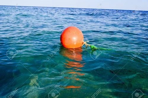 102958754-the-orange-large-round-plastic-rescue-buoy-floats-in-the-blue-salt-sea-for-safety-500x500-1 Floating Buoys - Image 1